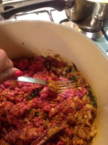 Break up all lumps with the back of a fork as you mix through onion spice mixture, over medium heat.