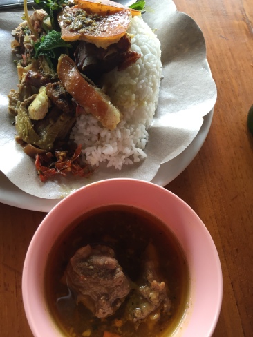 Rich, spicy pork soup accompanying Warung Ibu Suna's Babi Guling in Kedawtan near Ubud